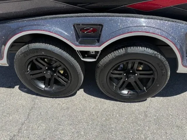 Slide: The Image of 2025 Ranger Z521R trailer with dual black wheels on a sunny day. - 3