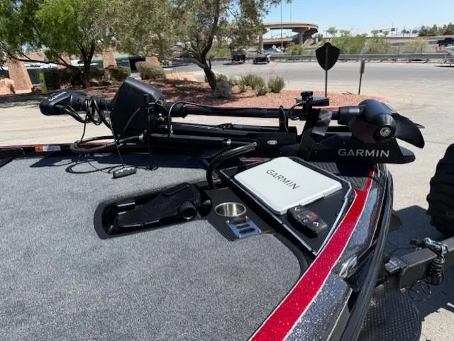 Slide: The Image of 2025 Ranger Z521R boat with Garmin equipment on deck, parked outdoors. - 8