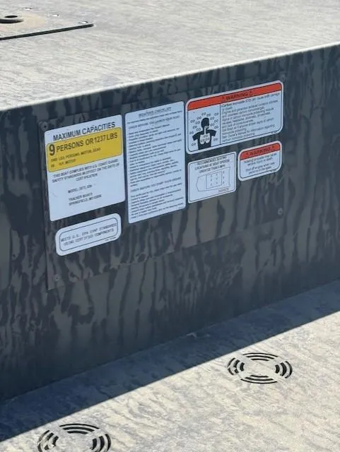 Slide: The Image of 2025 Tracker GRIZZLY 2072 Utility boat capacity and safety labels on deck. - 2