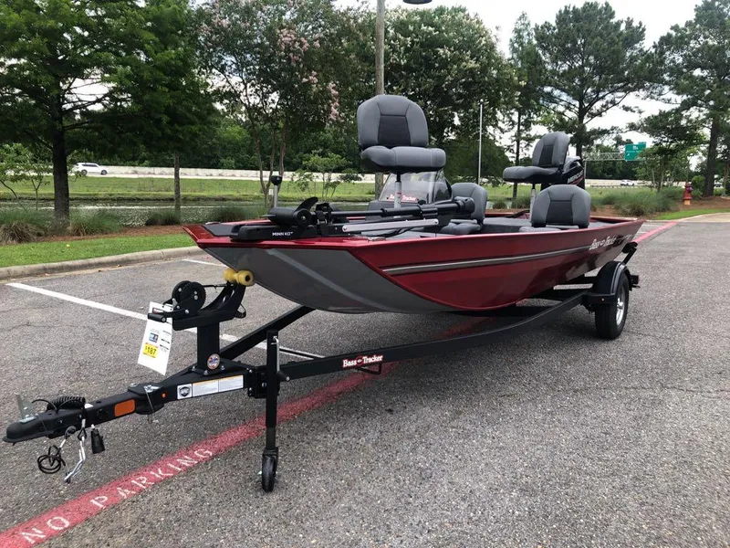 Slide: The Image of 2025 Tracker Bass Tracker Classic XL boat on trailer in parking lot. - 12