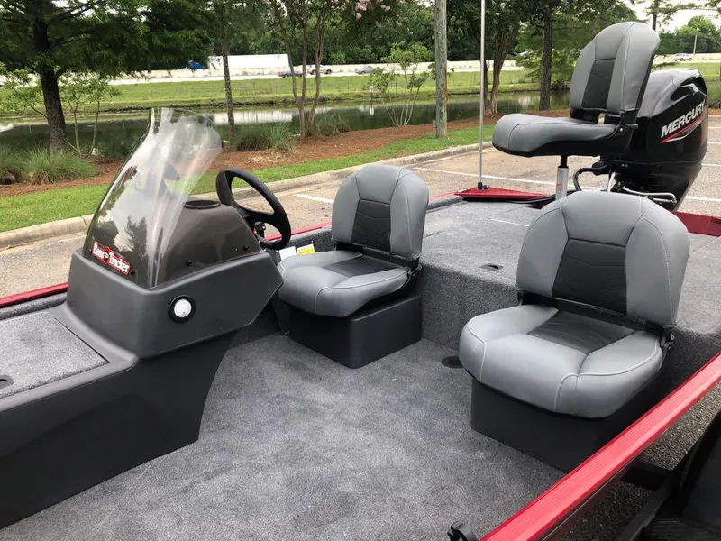 Slide: The Image of 2025 Tracker Bass Tracker Classic XL boat interior with seating and Mercury motor. - 9