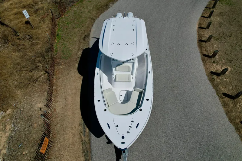 Slide: The Image of Aerial view of 2025 Cape Horn 24 XS boat on a road. - 13