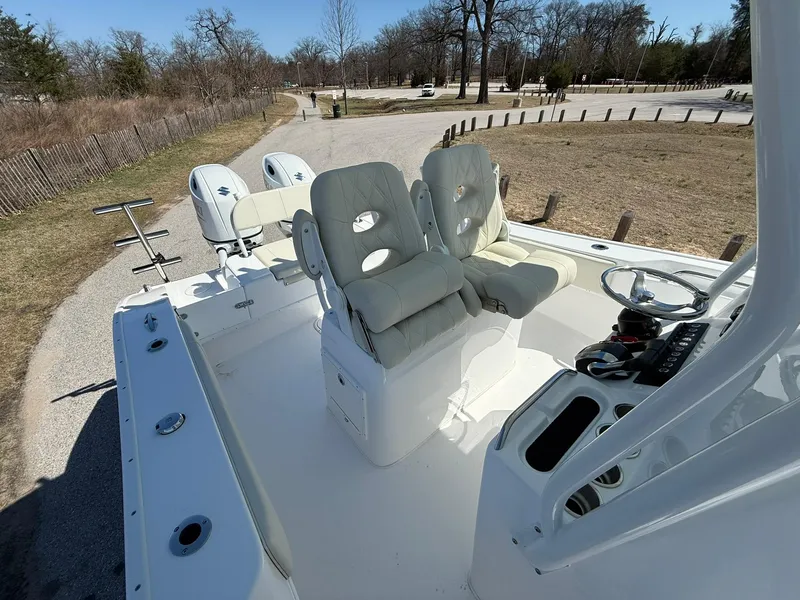 Slide: The Image of 2025 Cape Horn 24 XS boat interior with dual seats and steering console. - 28