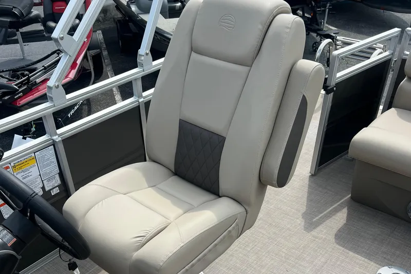 Slide: The Image of 2025 Sun Tracker Party Barge 20 DLX captain's chair, beige upholstery, luxury design. - 12