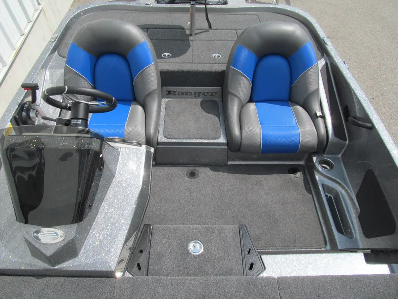 Slide: The Image of 2025 Ranger Z185 boat interior with dual blue and gray seats. - 12