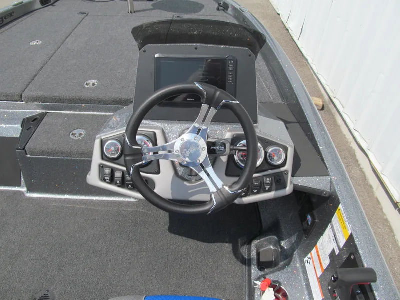 Slide: The Image of 2025 Ranger Z185 boat dashboard with steering wheel and control panel. - 6