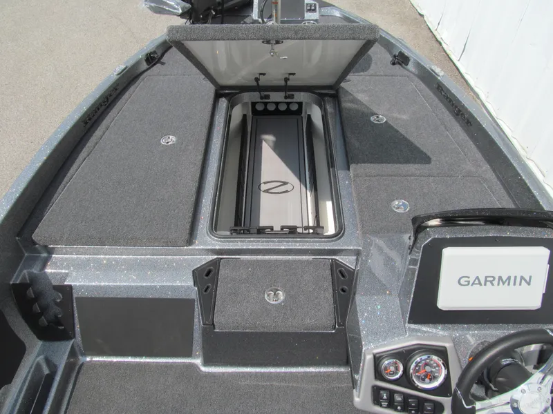 Slide: The Image of 2025 Ranger Z185 boat interior with Garmin system and storage compartments. - 9
