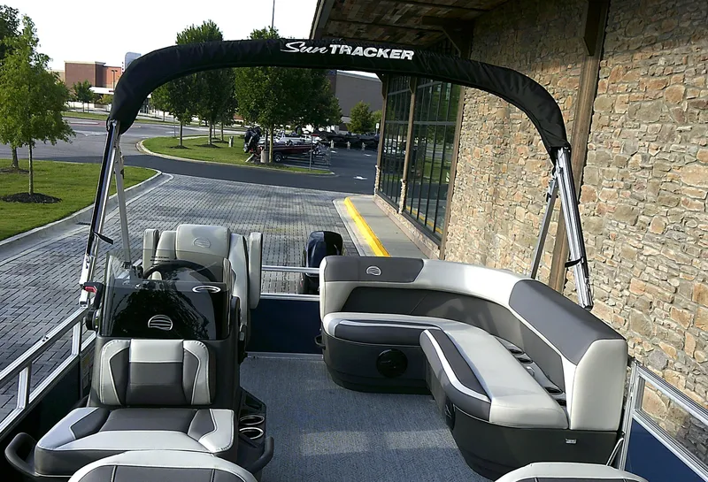 Slide: The Image of 2025 Sun Tracker Bass Buggy 16 XL Select pontoon boat with seating and canopy. - 4