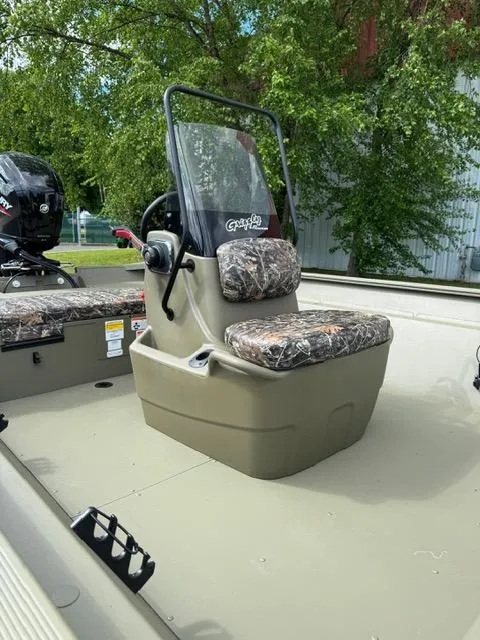 Slide: The Image of 2025 Tracker Grizzly 2072 CC boat with camo seats and steering console. - 10