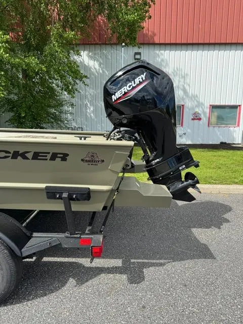 Slide: The Image of 2025 Tracker Grizzly 2072 CC boat with Mercury outboard motor on trailer. - 3