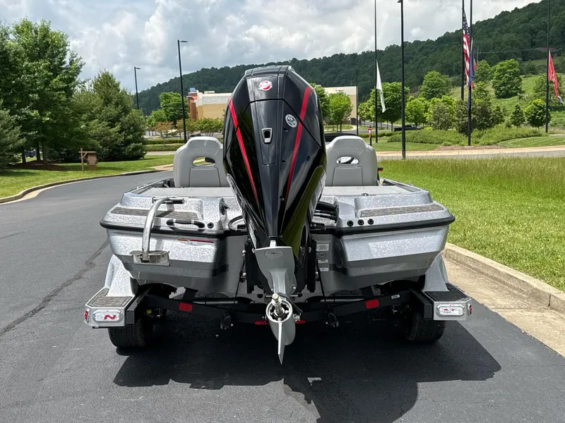 Slide: The Image of 2025 Nitro Z20 XL boat, rear view, parked on a sunny day. - 4