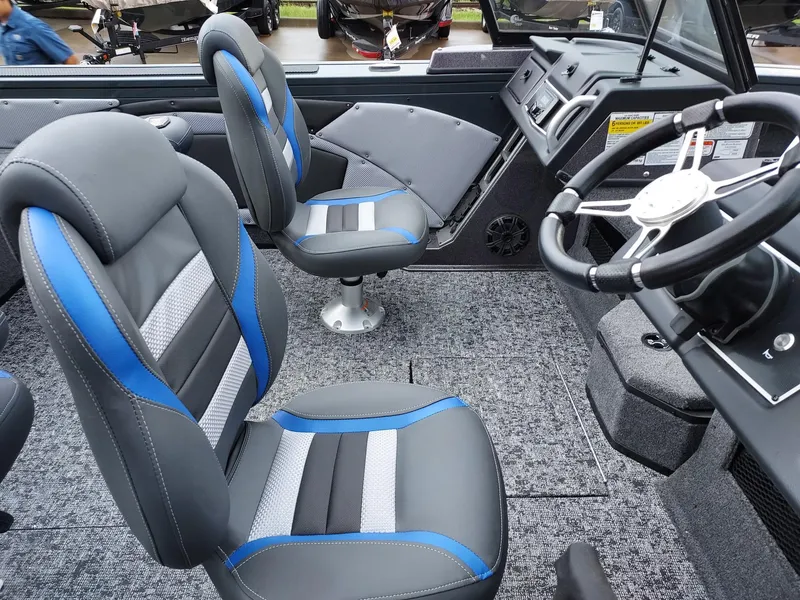 Slide: The Image of 2025 Ranger VX1788 WT boat interior with modern seating and steering wheel. - 1