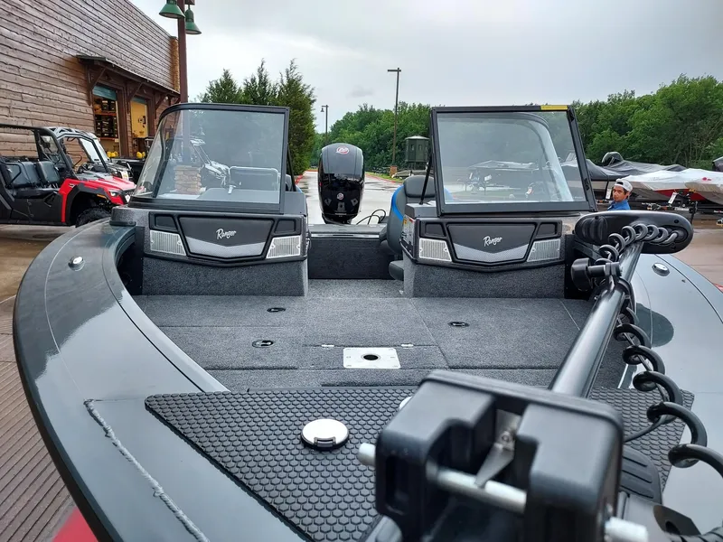 Slide: The Image of 2025 Ranger VX1788 WT boat with dual windshields and motor, displayed outdoors. - 2