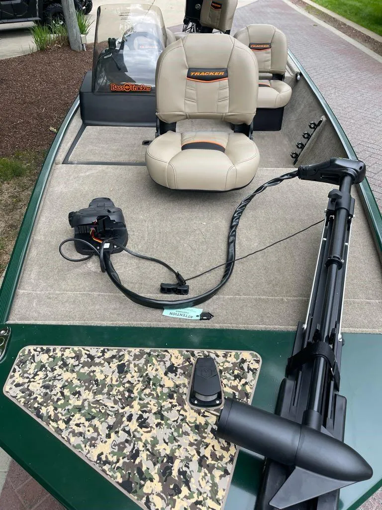Slide: The Image of 2025 Tracker Bass Tracker Classic Limited boat with beige seats and camouflage accents. - 3