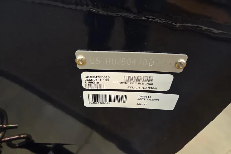 The Image of 2025 Tracker Super Guide V-16 T boat displayed in a showroom with fishing gear. - 0