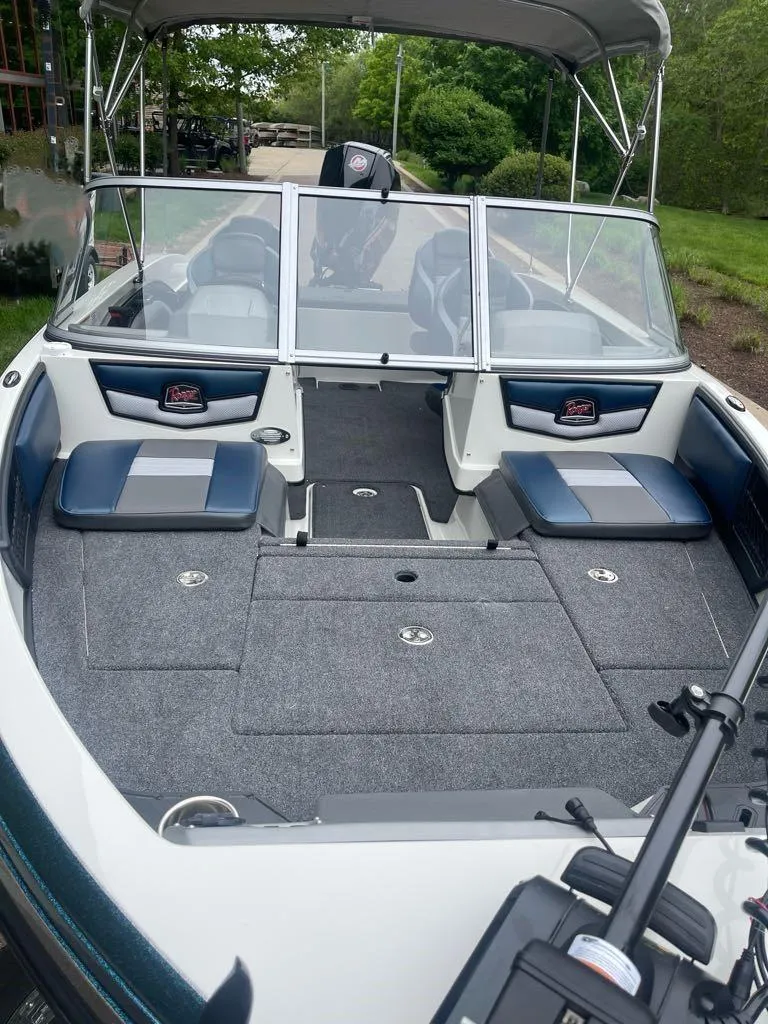 Slide: The Image of 2025 Ranger 1850MS boat interior with seating and windshield, featuring modern design and spacious layout. - 3