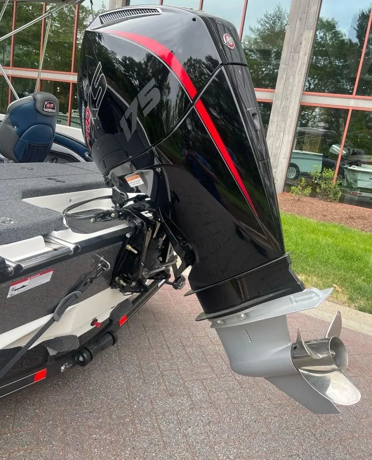 Slide: The Image of 2025 Ranger 1850MS boat with powerful outboard motor, sleek black and red design. - 8