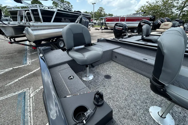 Slide: The Image of 2025 Tracker Super Guide V-16 T boat interior with seating and Mercury outboard motor. - 5