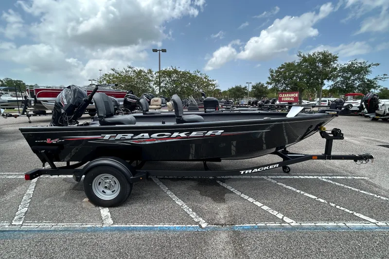 The Image of 2025 Tracker Super Guide V-16 T boat on trailer in parking lot. - 0