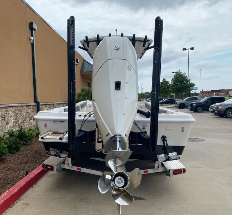 Slide: The Image of 2025 Ranger 2510 Bay boat on trailer, rear view with outboard motor. - 4