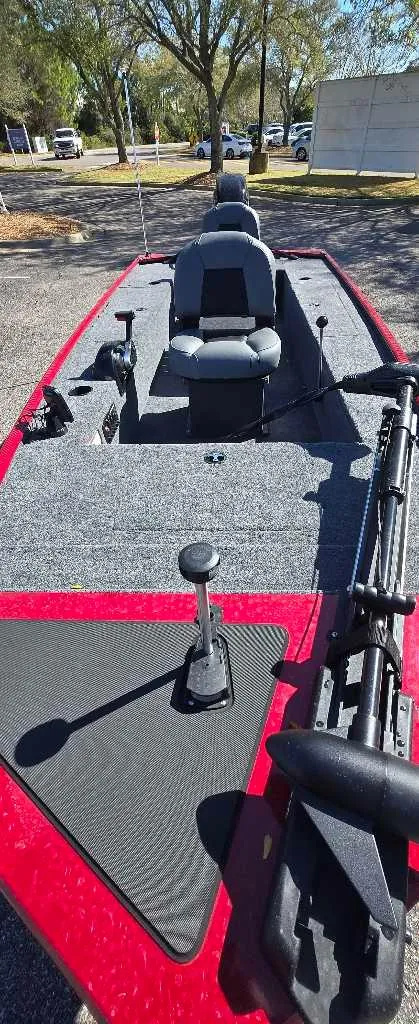 Slide: The Image of 2025 Tracker Panfish 17 boat with seating and fishing equipment on deck. - 2