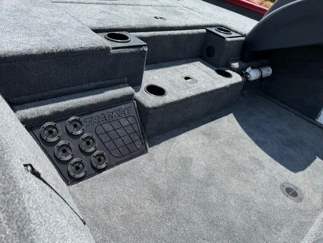 Slide: The Image of Interior of 2025 Tracker Pro Team 195 Tournament Edition boat, featuring carpeted deck and storage compartments. - 10