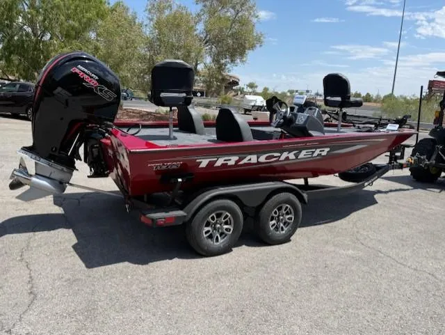 Slide: The Image of 2025 Tracker Pro Team 195 Tournament Edition boat on trailer, parked outdoors. - 3