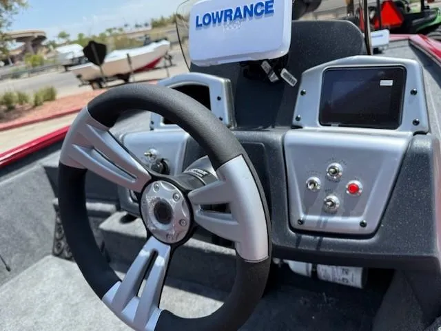 Slide: The Image of Steering wheel and dashboard of 2025 Tracker Pro Team 195 Tournament Edition boat. - 4