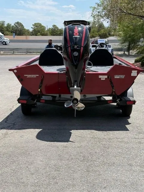 Slide: The Image of 2025 Tracker Pro Team 195 Tournament Edition boat on trailer, rear view in parking lot. - 7