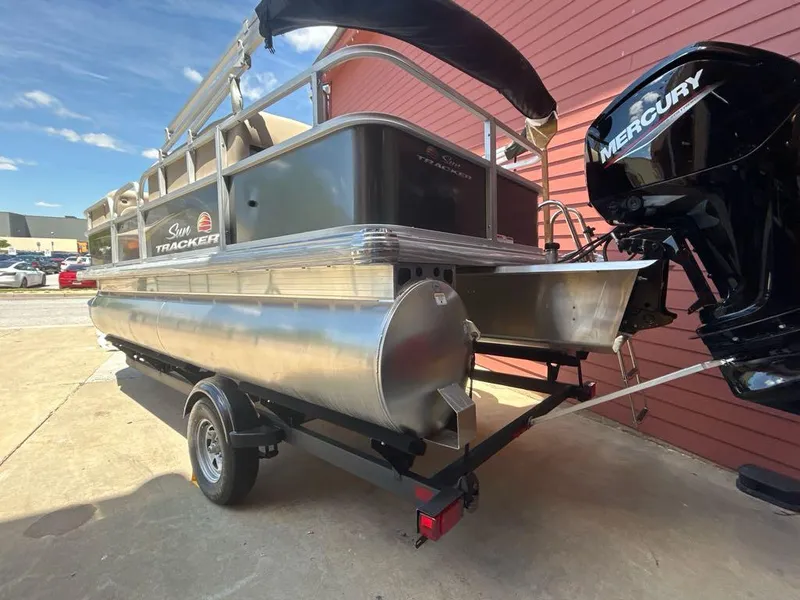 Slide: The Image of 2025 Sun Tracker Party Barge 18 DLX pontoon boat with Mercury outboard motor. - 3