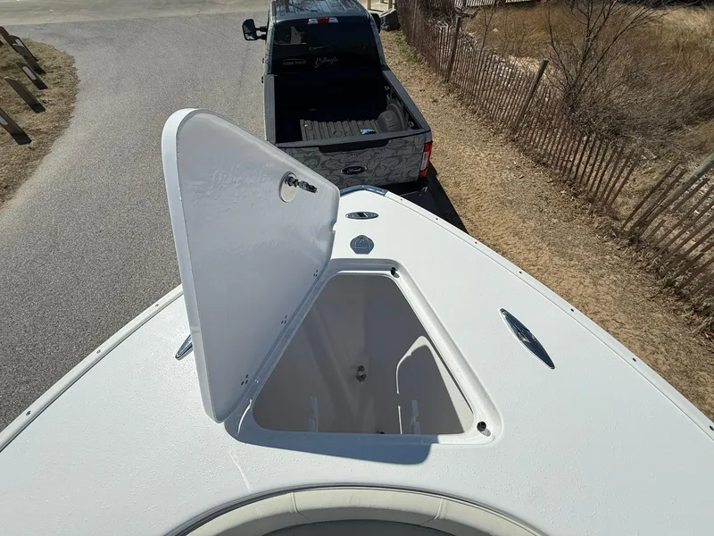 Slide: The Image of 2025 Cape Horn 24 XS boat with open storage compartment, viewed from above. - 29