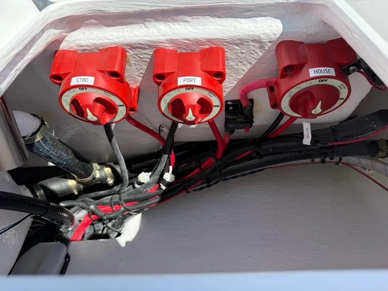 Slide: The Image of Battery switches on a 2025 Cape Horn 24 XS boat, labeled STBD, PORT, and HOUSE. - 31