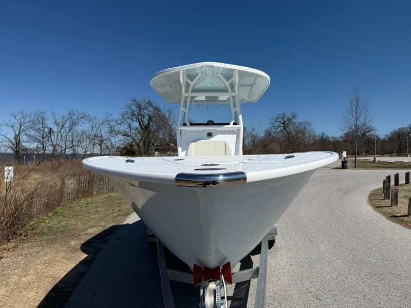 Slide: The Image of 2025 Cape Horn 24 XS boat on trailer, parked on a sunny day. - 34