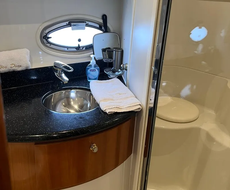 Slide: The Image of Luxurious bathroom in 2002 Carver 396 Motor Yacht with sink and shower. - 16