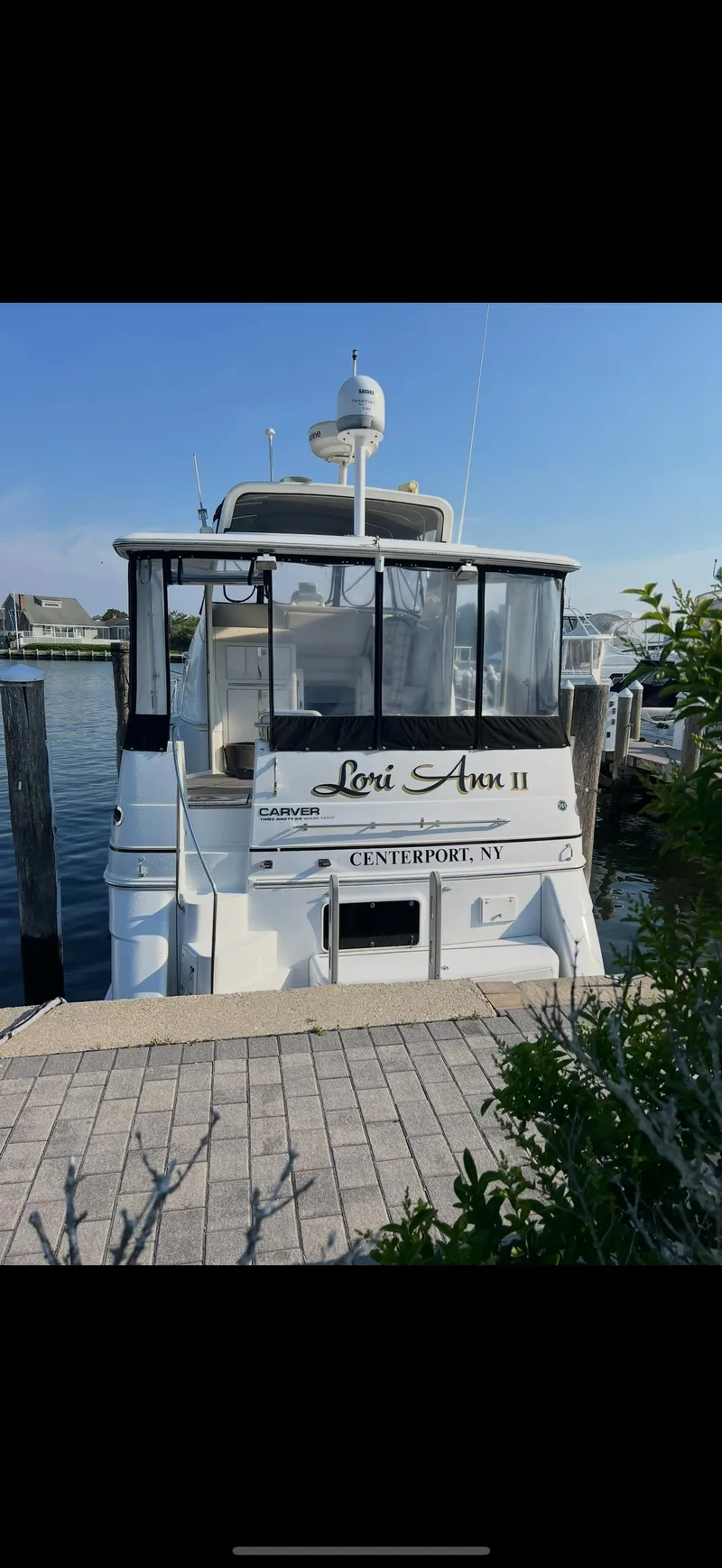 Slide: The Image of 2002 Carver 396 Motor Yacht docked at a marina, sunny day. - 14