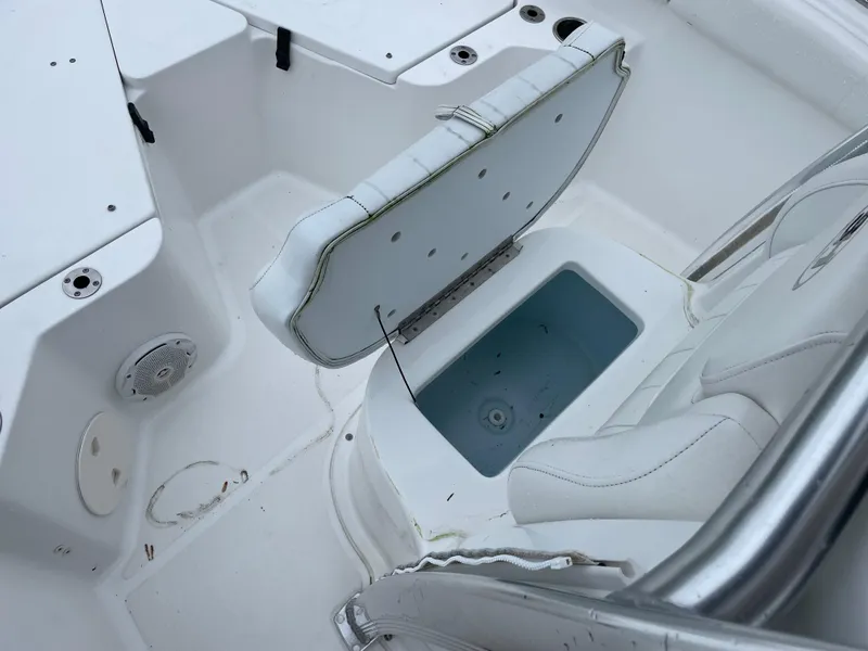 Slide: The Image of 2017 Sea Hunt 21 CC boat interior with open storage compartment. - 18