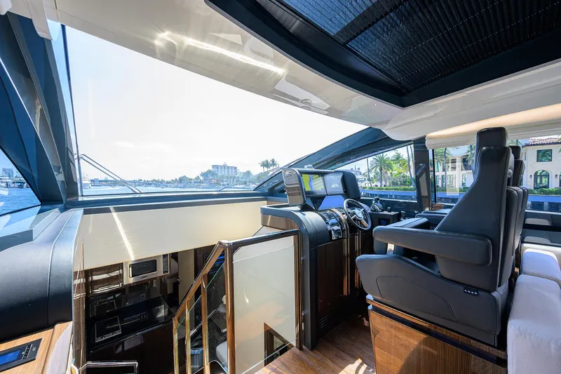 Slide: The Image of Luxurious interior of 2023 Lazzara LSX 67 yacht with modern helm and panoramic views. - 16