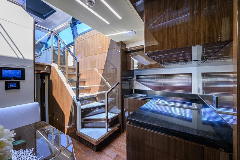 Slide: The Image of Luxurious interior of 2023 Lazzara LSX 67 yacht with modern staircase and sleek design. - 20