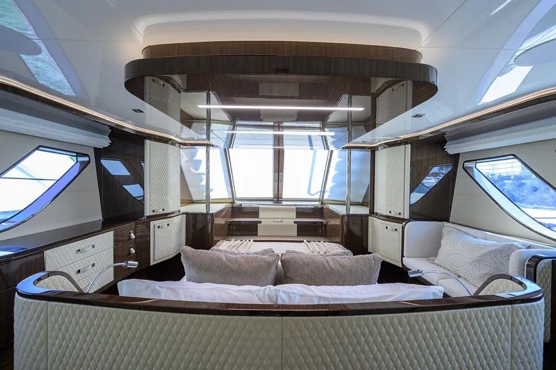 Slide: The Image of Luxurious interior of 2023 Lazzara LSX 67 yacht with elegant furnishings and panoramic windows. - 23