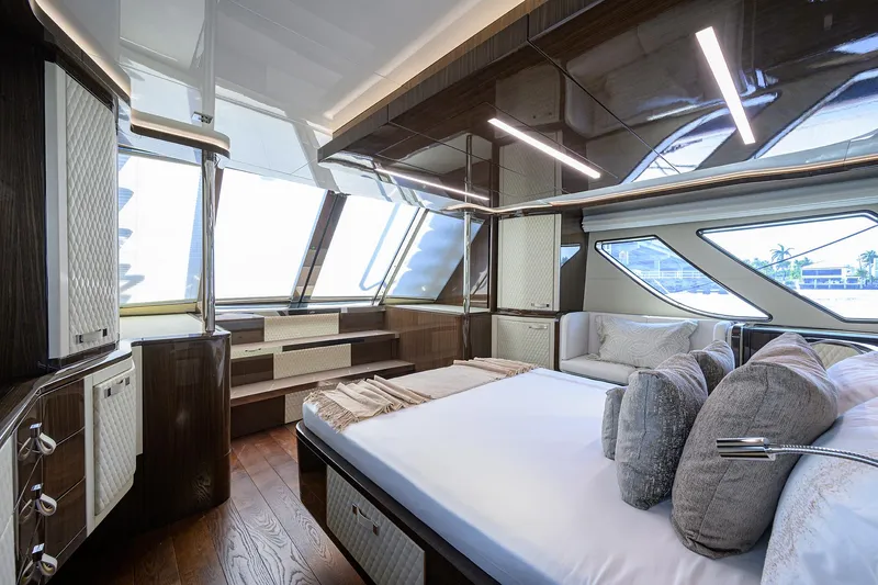 Slide: The Image of Luxurious 2023 Lazzara LSX 67 yacht bedroom with modern design and large windows. - 24