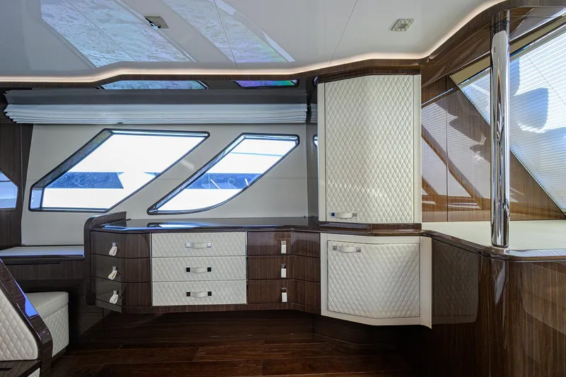 Slide: The Image of Luxurious interior of 2023 Lazzara LSX 67 yacht with modern cabinetry and sleek windows. - 27