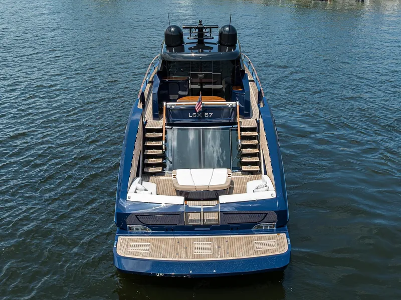 Slide: The Image of 2023 Lazzara LSX 67 yacht on water, rear view, luxury design. - 3