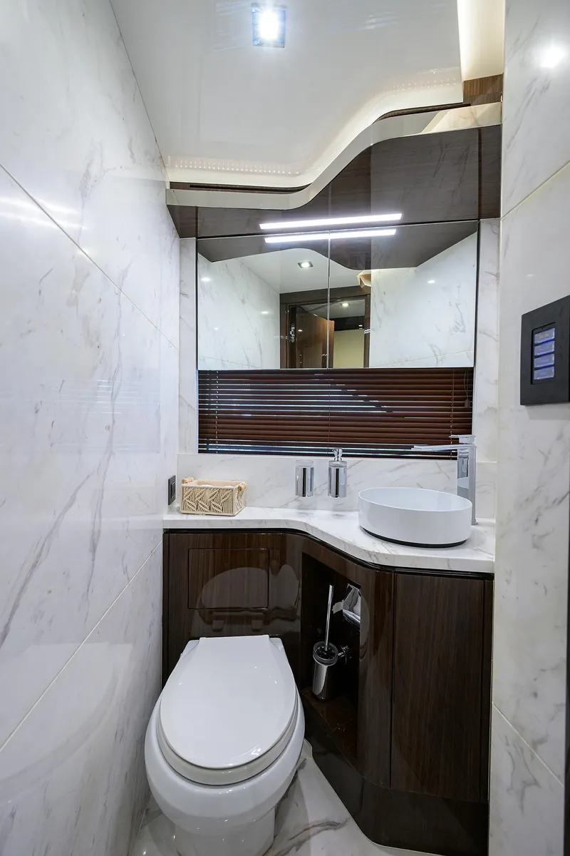 Slide: The Image of Luxurious bathroom in 2023 Lazzara LSX 67 yacht with modern fixtures and elegant design. - 30