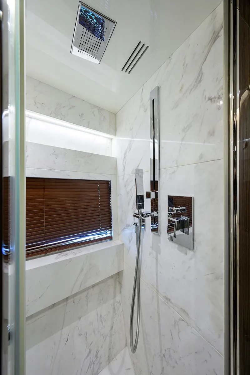Slide: The Image of Luxurious marble shower in 2023 Lazzara LSX 67 yacht, featuring modern fixtures and sleek design. - 31