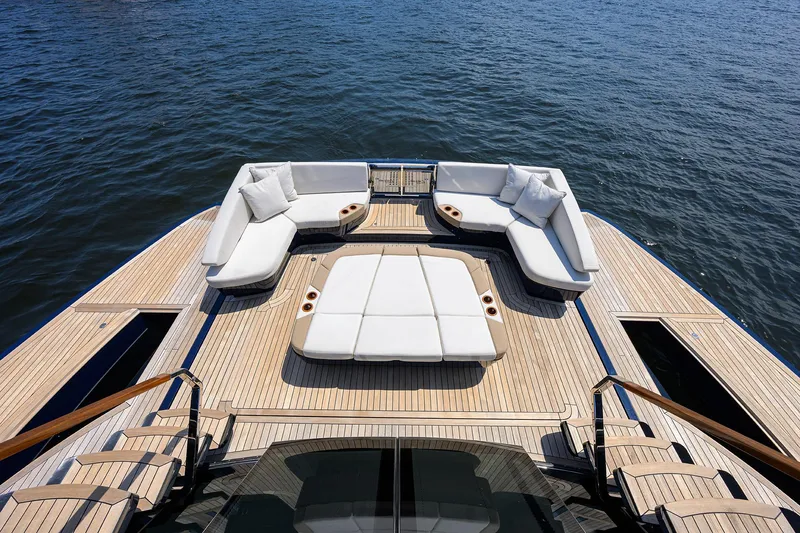 Slide: The Image of Luxurious 2023 Lazzara LSX 67 yacht deck with elegant seating overlooking the ocean. - 8