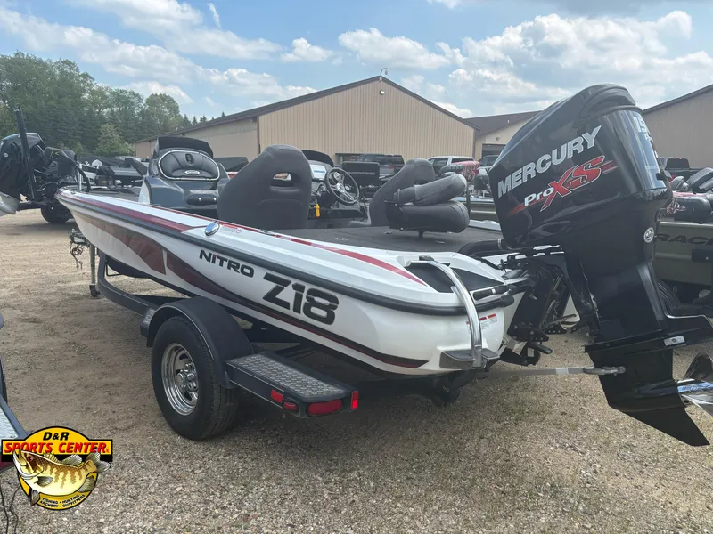 Slide: The Image of 2017 Nitro Z18 boat with Mercury Pro XS engine, parked outdoors. - 20