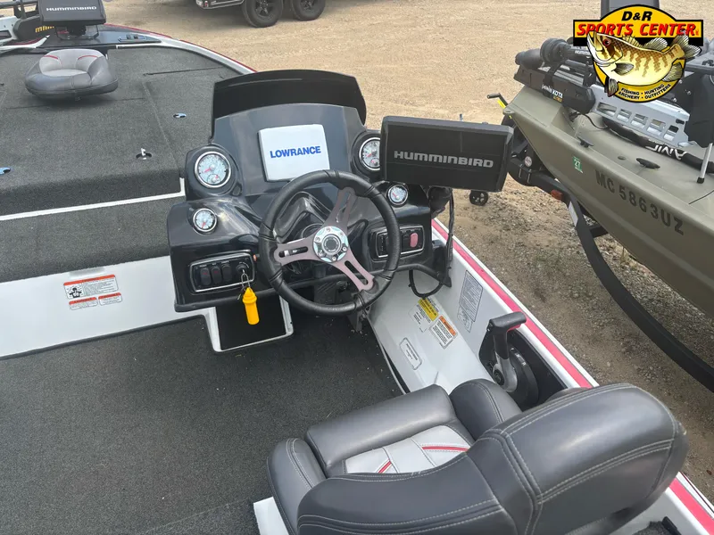 Slide: The Image of Nitro Z18 2017 boat dashboard with Lowrance and Humminbird electronics, steering wheel, and seat. - 23