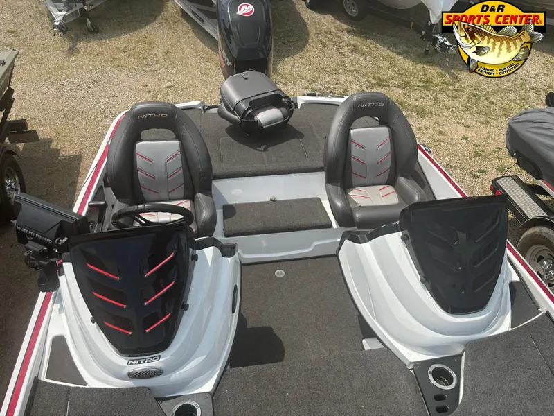 Slide: The Image of 2017 Nitro Z18 boat interior with dual seats and steering consoles at D&R Sports Center. - 24