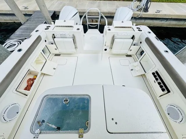 Slide: The Image of 2020 World Cat 32 boat interior with dual engines, spacious deck, and storage compartments. - 10
