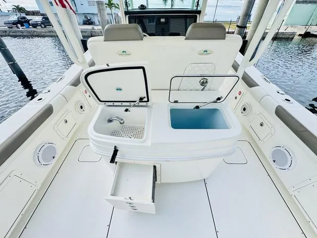 Slide: The Image of 2020 World Cat 32 boat interior with open storage compartments and seating. - 14